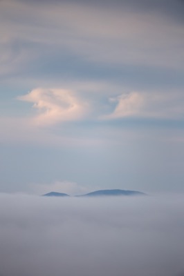 Mountaintop Peeking Over Thick Cloud Cover