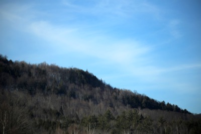 Faint Clouds Over Hillside